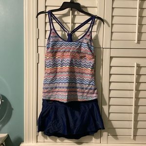 Two peice bathing suit. Navy bottom, multi colored top. Size M